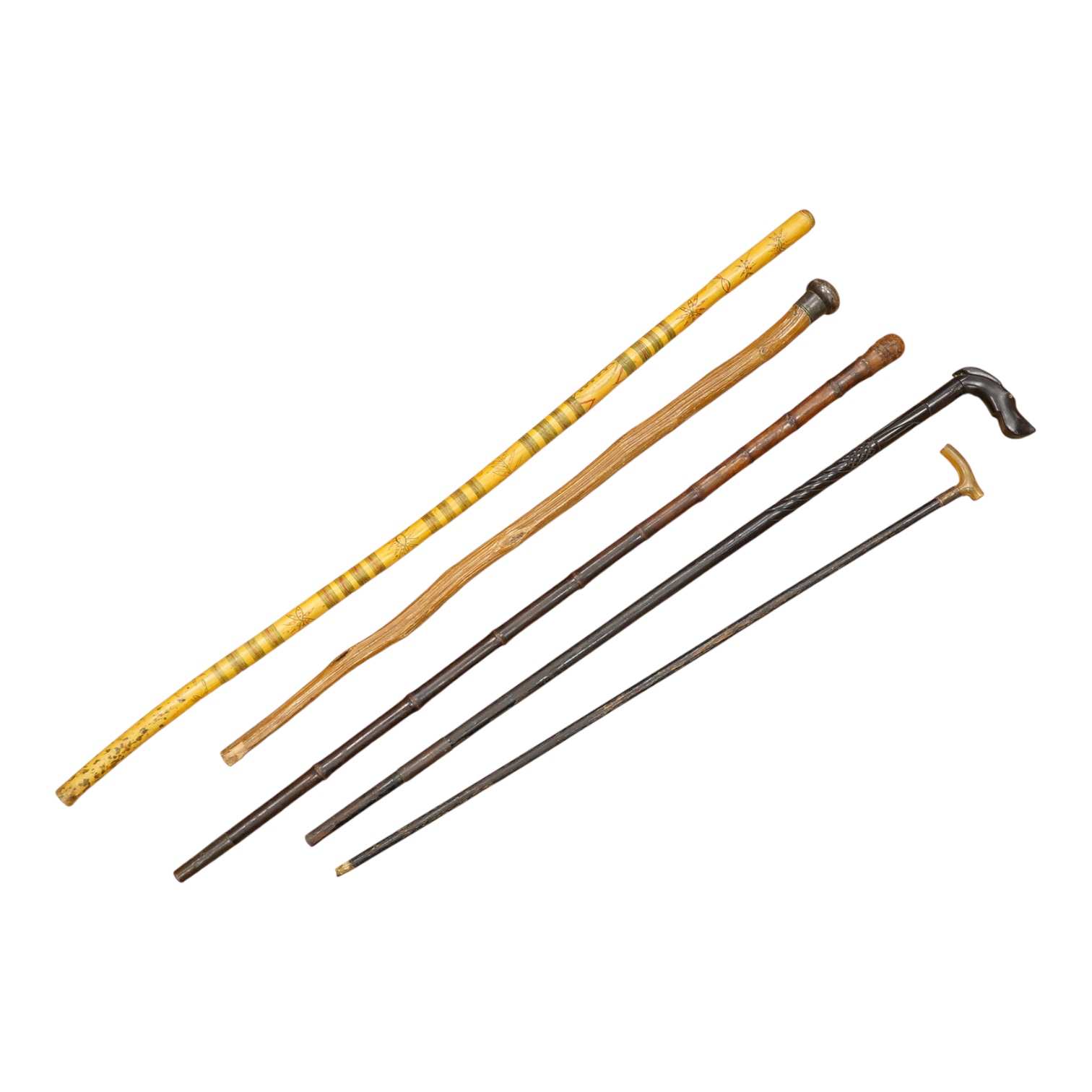 Five walking sticks including horn and a silver topped walking sticks and a carved topped walking stick with concealed chamber containing a metal tube - 93cm long. (5).